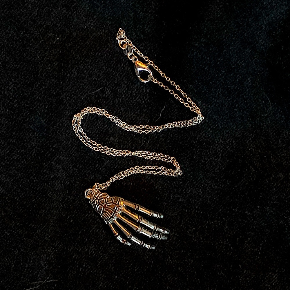Sliver skeleton hand necklace